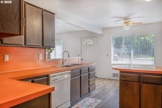 422 E 5th St, Coquille, OR 97423 - kitchen with white dishwasher, a sink, a ceiling fan, light countertops, and light wood-style floors