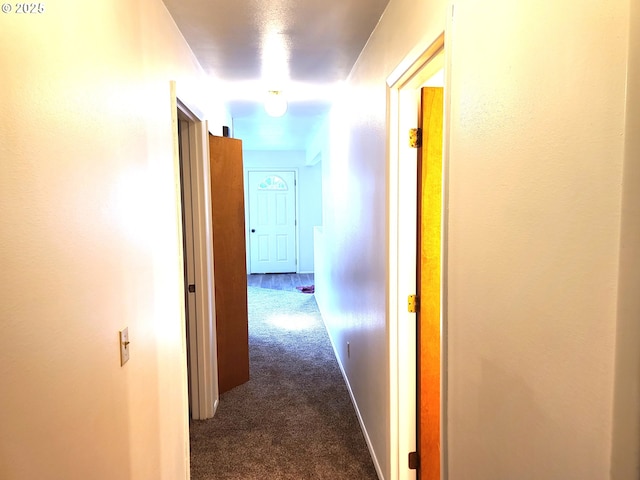 hallway with dark carpet