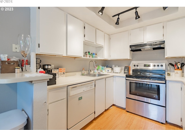 kitchen featuring dishwasher, sink, stainless steel electric stove, white cabinets, and light wood-type flooring