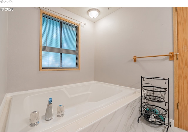 bathroom with tiled tub