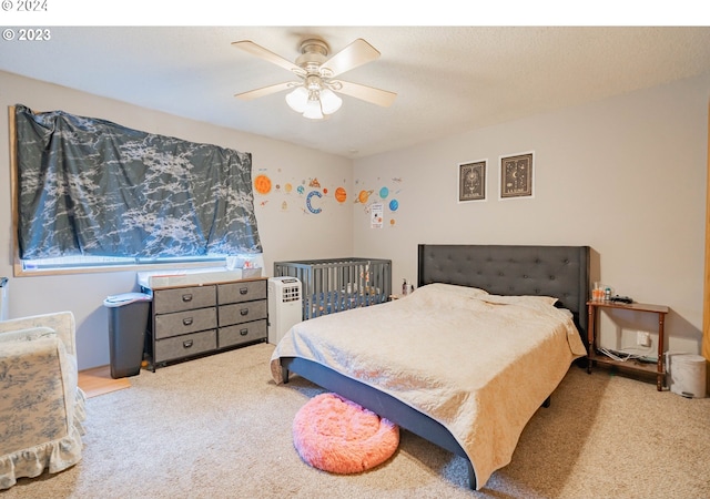 carpeted bedroom featuring ceiling fan