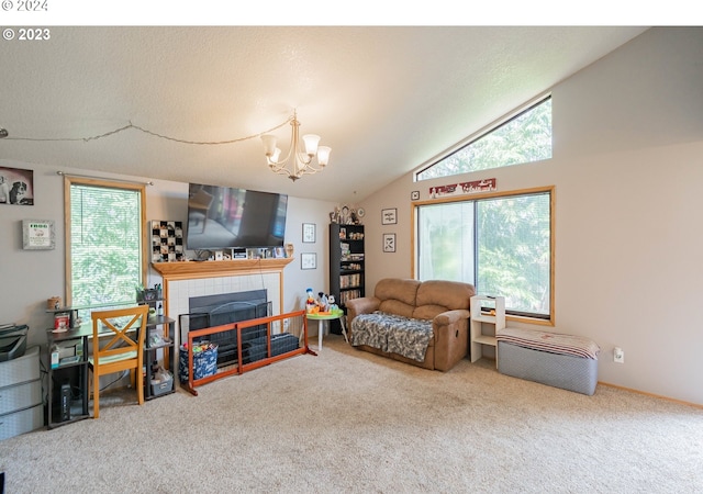 living room featuring carpet, lofted ceiling, a tile fireplace, and an inviting chandelier