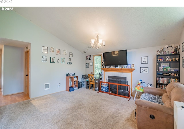 living room featuring carpet, vaulted ceiling, and a chandelier