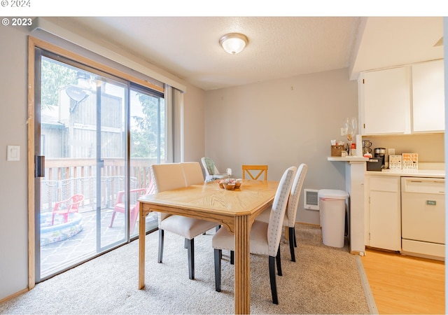 dining area with light hardwood / wood-style flooring