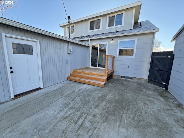 back of property with a patio and fence