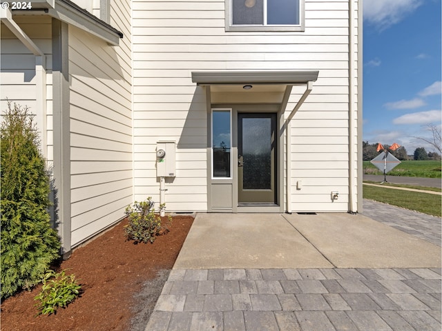 entrance to property with a patio area