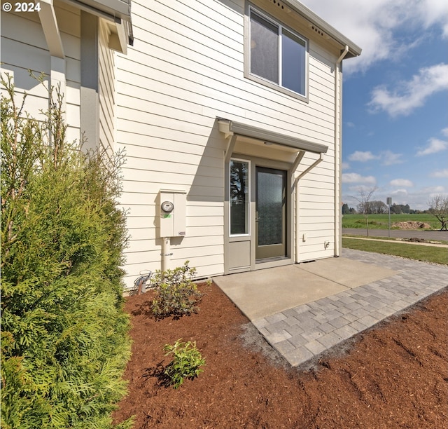 property entrance with a patio area