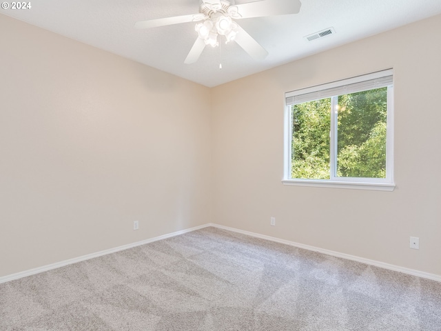 empty room featuring carpet flooring and ceiling fan