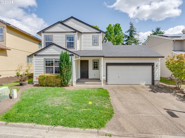 view of property with a garage and a front yard