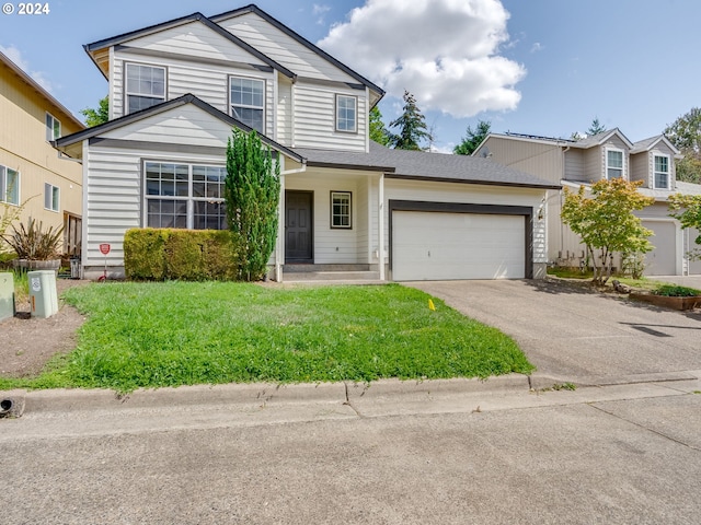 traditional home with a front lawn, an attached garage, and driveway