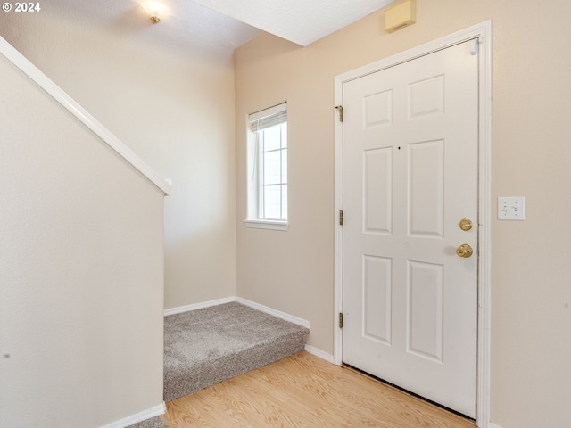 foyer entrance featuring light hardwood / wood-style flooring