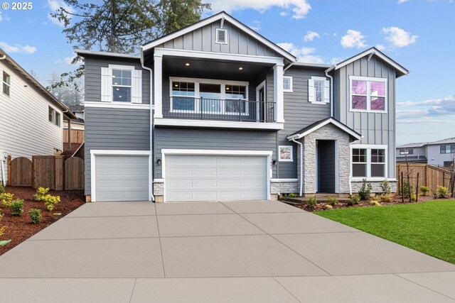 craftsman-style home featuring a garage and a balcony