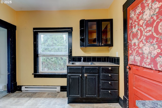 bathroom with baseboard heating and vanity