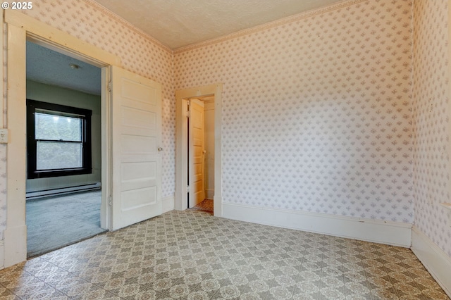 unfurnished room featuring carpet, baseboard heating, and ornamental molding