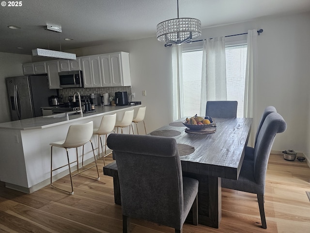 4024 NE 166th Ave, Vancouver, WA 98682 - dining area featuring wood finished floors and a chandelier