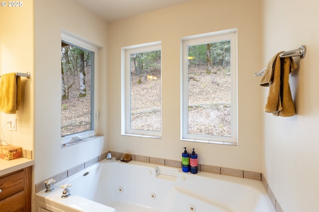 full bath featuring plenty of natural light and a whirlpool tub