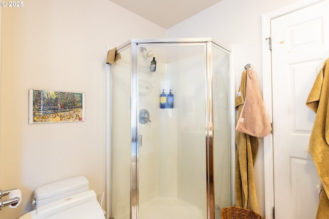 full bath with a shower stall and toilet