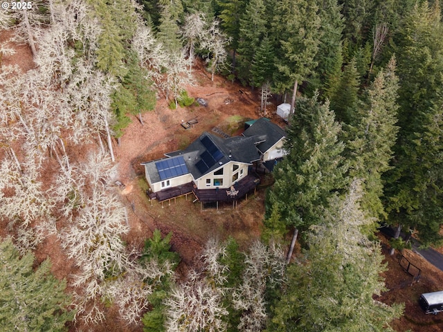 birds eye view of property with a forest view