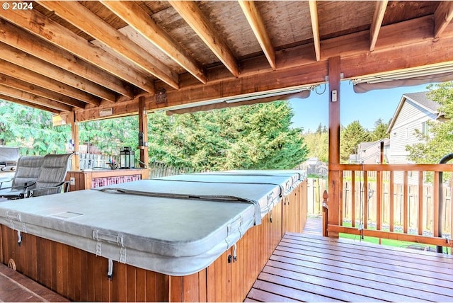 wooden terrace with a hot tub