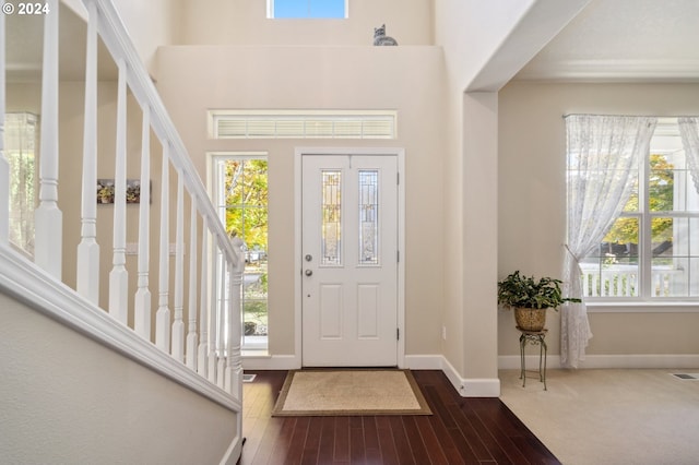 entrance foyer with dark hardwood / wood-style floors