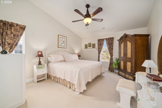 bedroom featuring ceiling fan, lofted ceiling, and light colored carpet