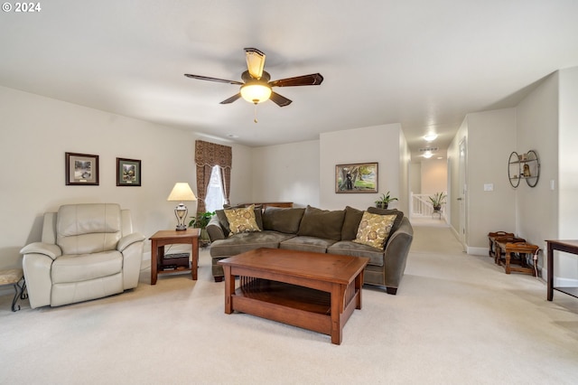 living room with light colored carpet and ceiling fan