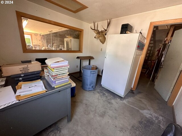 home office featuring concrete floors