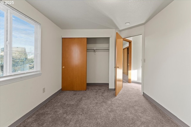 2427 SW 218th Dr, Beaverton, OR 97003 - unfurnished bedroom with carpet, a closet, baseboards, and a textured ceiling