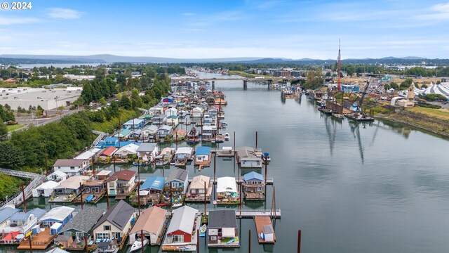 bird's eye view with a water and mountain view