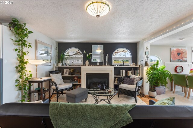 living room featuring a textured ceiling