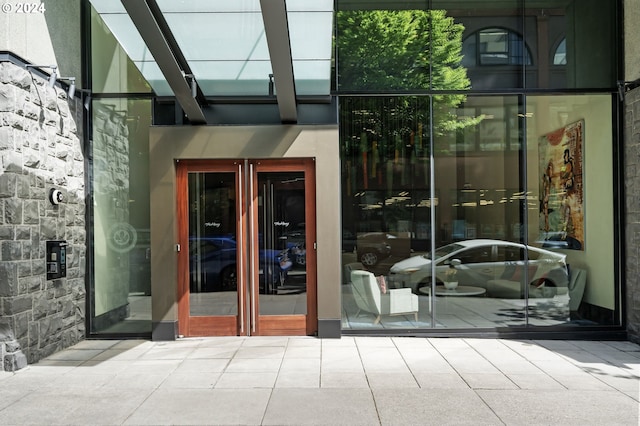 entrance to property featuring a patio