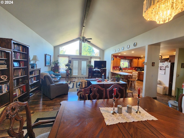 kitchen featuring white appliances, a kitchen bar, sink, and kitchen peninsula