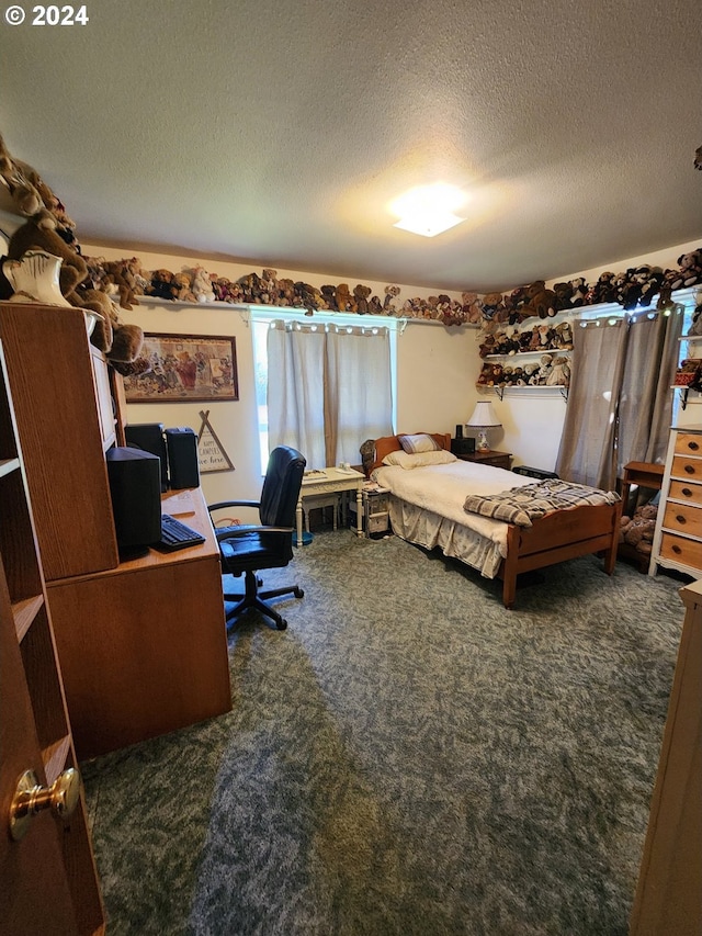 office with a textured ceiling and dark carpet