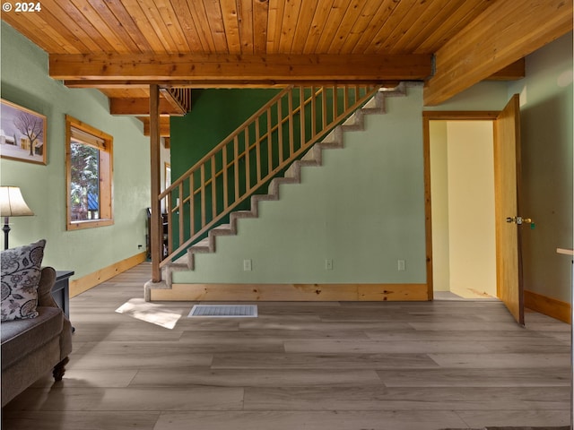 88940 E Round Mountain Loop, Government Camp, OR 97028 - stairway featuring wooden ceiling with exposed beams, wood finished floors, and baseboards