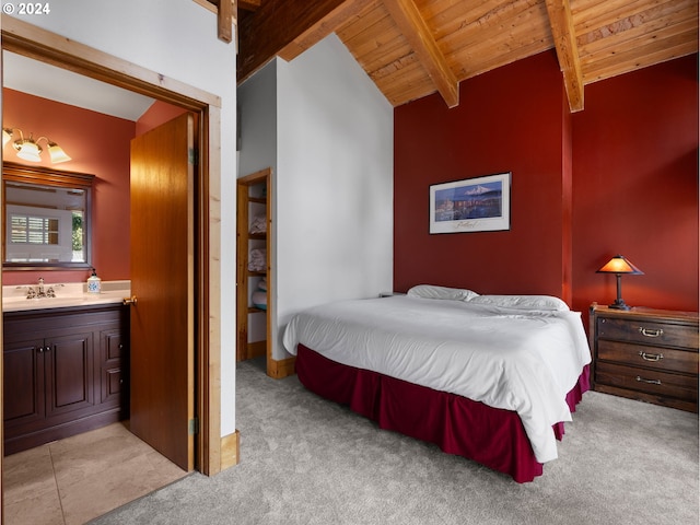 carpeted bedroom featuring wood ceiling, sink, and vaulted ceiling with beams