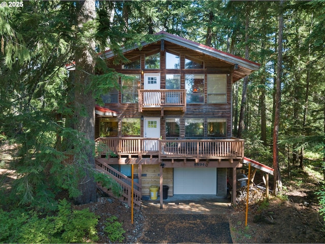 88940 E Round Mountain Loop, Government Camp, OR 97028 - rear view of property featuring an attached garage, driveway, a deck, and a balcony