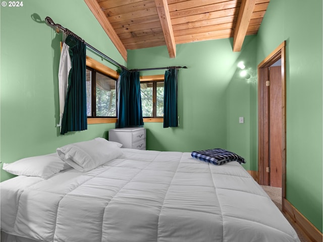 bedroom featuring vaulted ceiling with beams and wooden ceiling