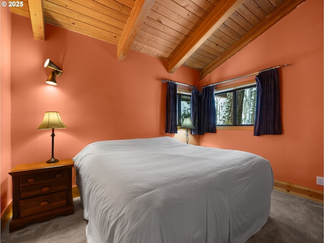 bedroom with carpet floors, vaulted ceiling with beams, and wooden ceiling