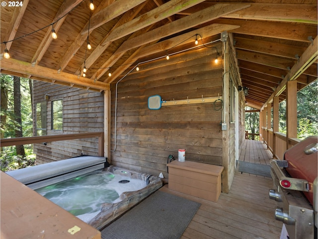 wooden terrace featuring a jacuzzi