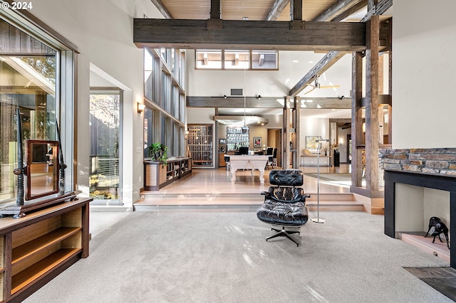 entrance foyer with beam ceiling and a wealth of natural light