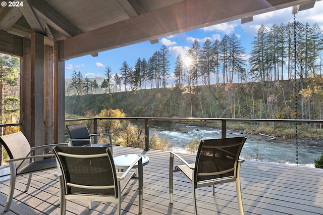 wooden terrace with a water view