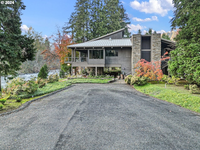 view of front of house featuring a sunroom