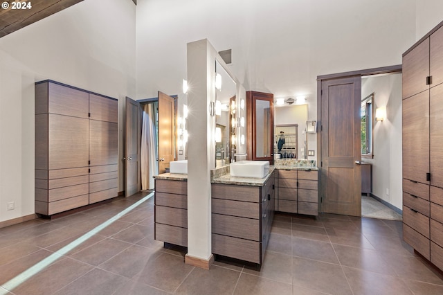 bathroom with tile patterned flooring and vanity