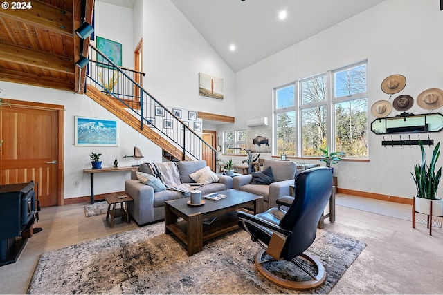 living room with wooden ceiling, a wood stove, light carpet, high vaulted ceiling, and a wall mounted AC