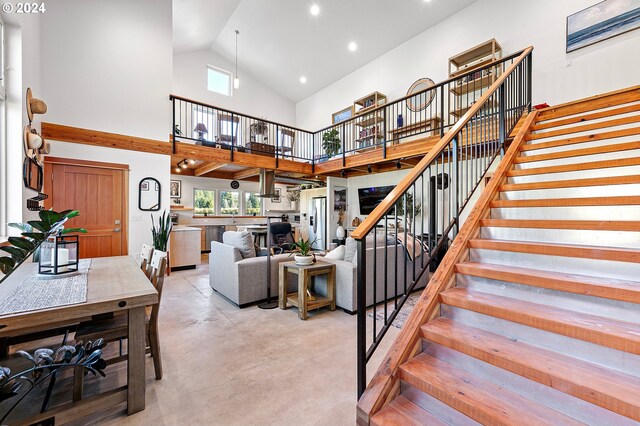 45650/45646 Mckenzie Hwy, Vida, OR 97488 - stairway featuring high vaulted ceiling, plenty of natural light, concrete flooring, and recessed lighting