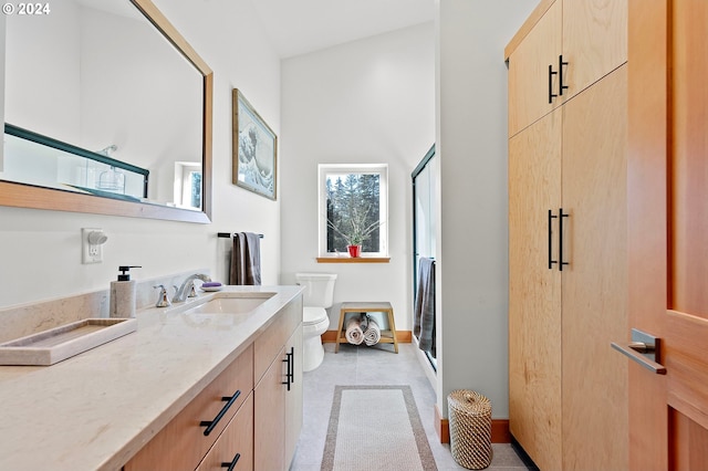 bathroom featuring walk in shower, tile patterned floors, lofted ceiling, toilet, and vanity