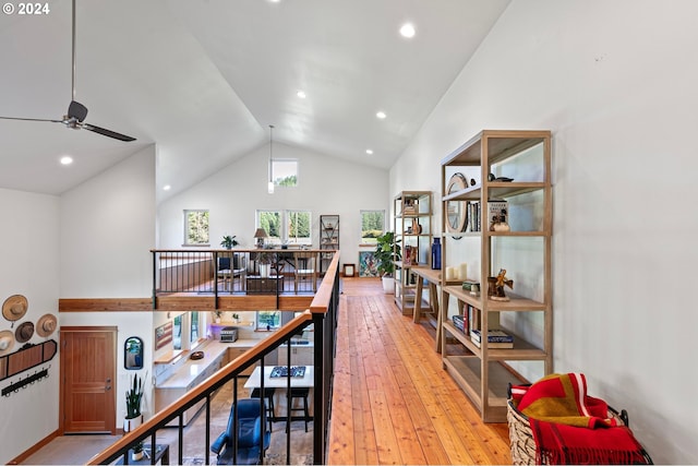 office area featuring ceiling fan, high vaulted ceiling, and light hardwood / wood-style flooring