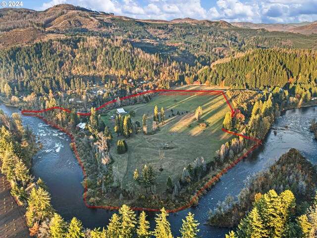 45650/45646 Mckenzie Hwy, Vida, OR 97488 - aerial view of property's location with property parcel outlined, a water and mountain view, and a forest