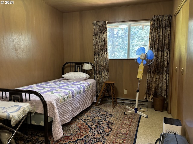 bedroom featuring wooden walls