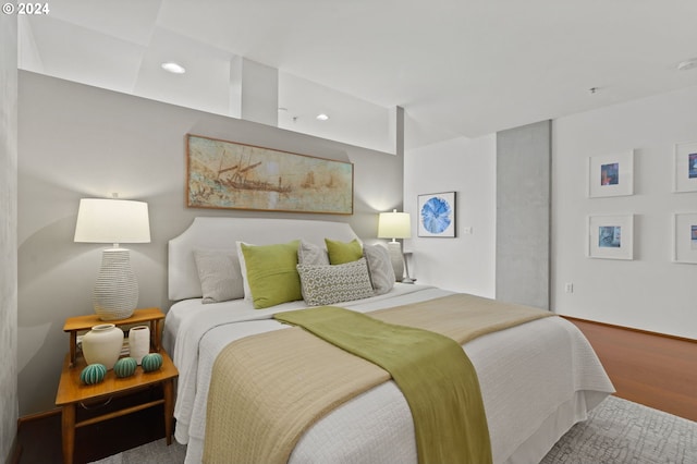 bedroom with wood-type flooring